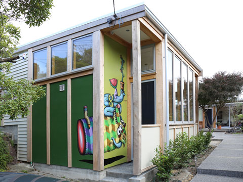 Albert-St-6 Timber-framed studio extension with green cladding and a painted mural