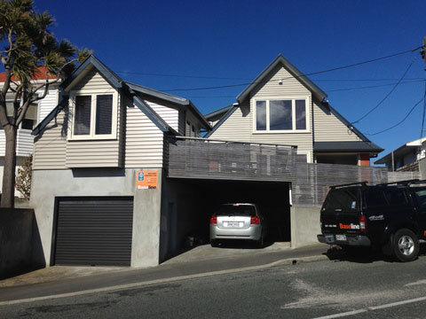 Buckley-191 Two-storey weatherboard house with a garage below, in Wellington