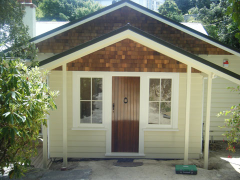 Parker1 Renovated weatherboard cottage with cedar shingle gables and a timber front door